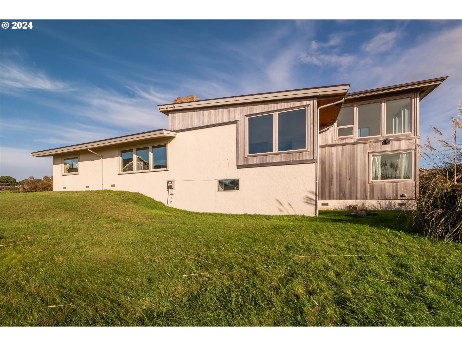 1190 Beach Loop Road Bandon, OR 97411 - Photo 35 of 39 a house view with a backyard space