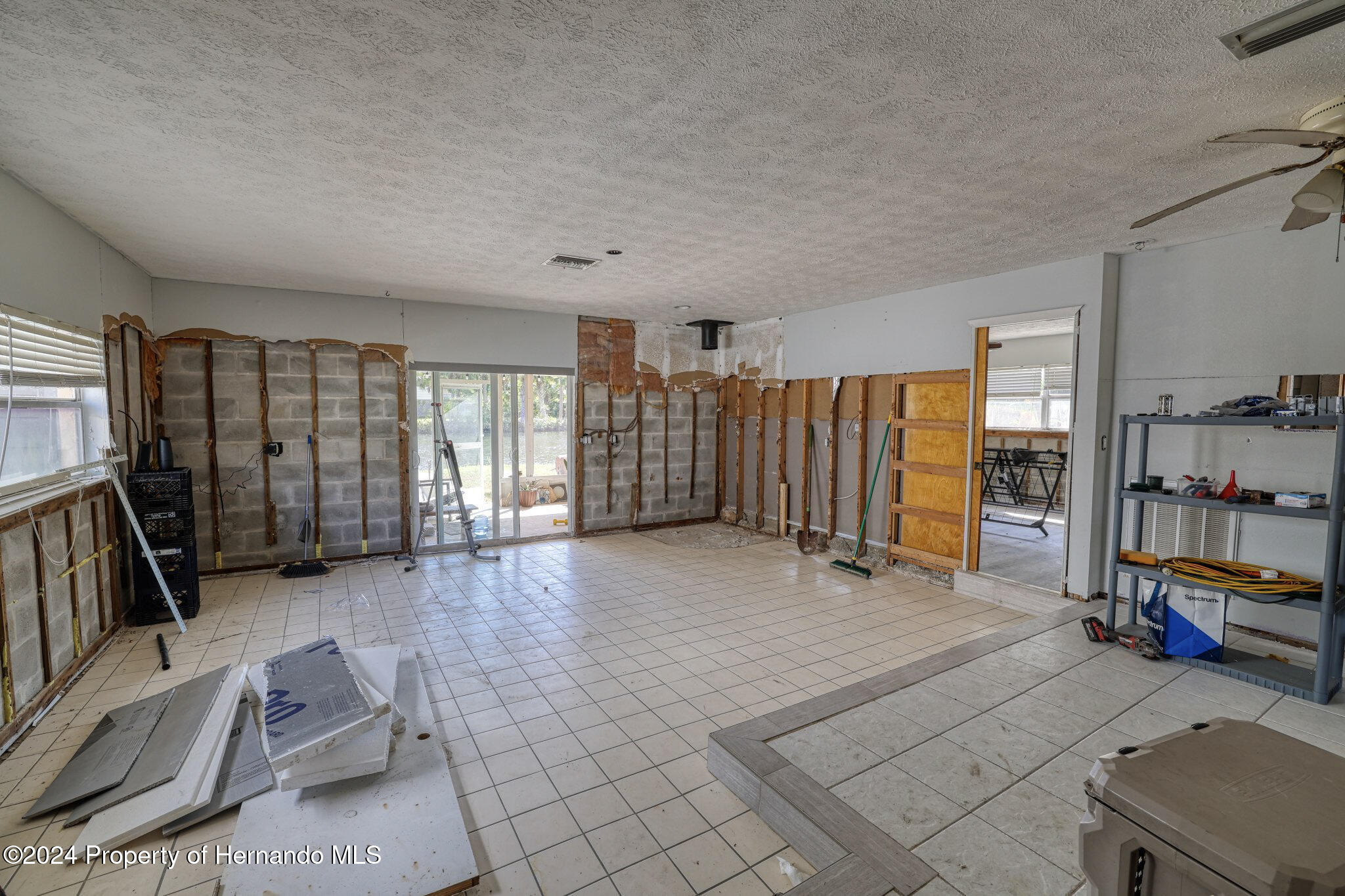 3186 Gulf Drive Aripeka, FL 34607 - Photo 11 of 19 a living room with furniture and gym equipment