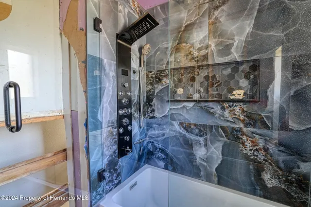 a view of a room with furniture and windows