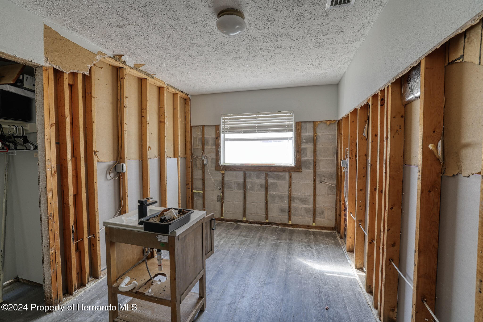 3186 Gulf Drive Aripeka, FL 34607 - Photo 14 of 19 a view of a room with furniture and windows