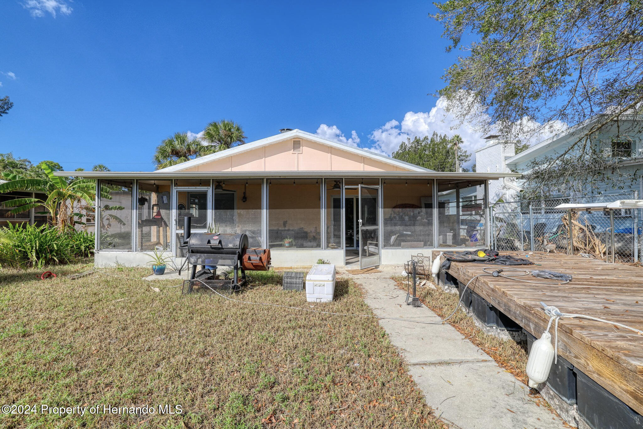 3186 Gulf Drive Aripeka, FL 34607 - Photo 18 of 19 a view of a house with backyard sitting area and porch