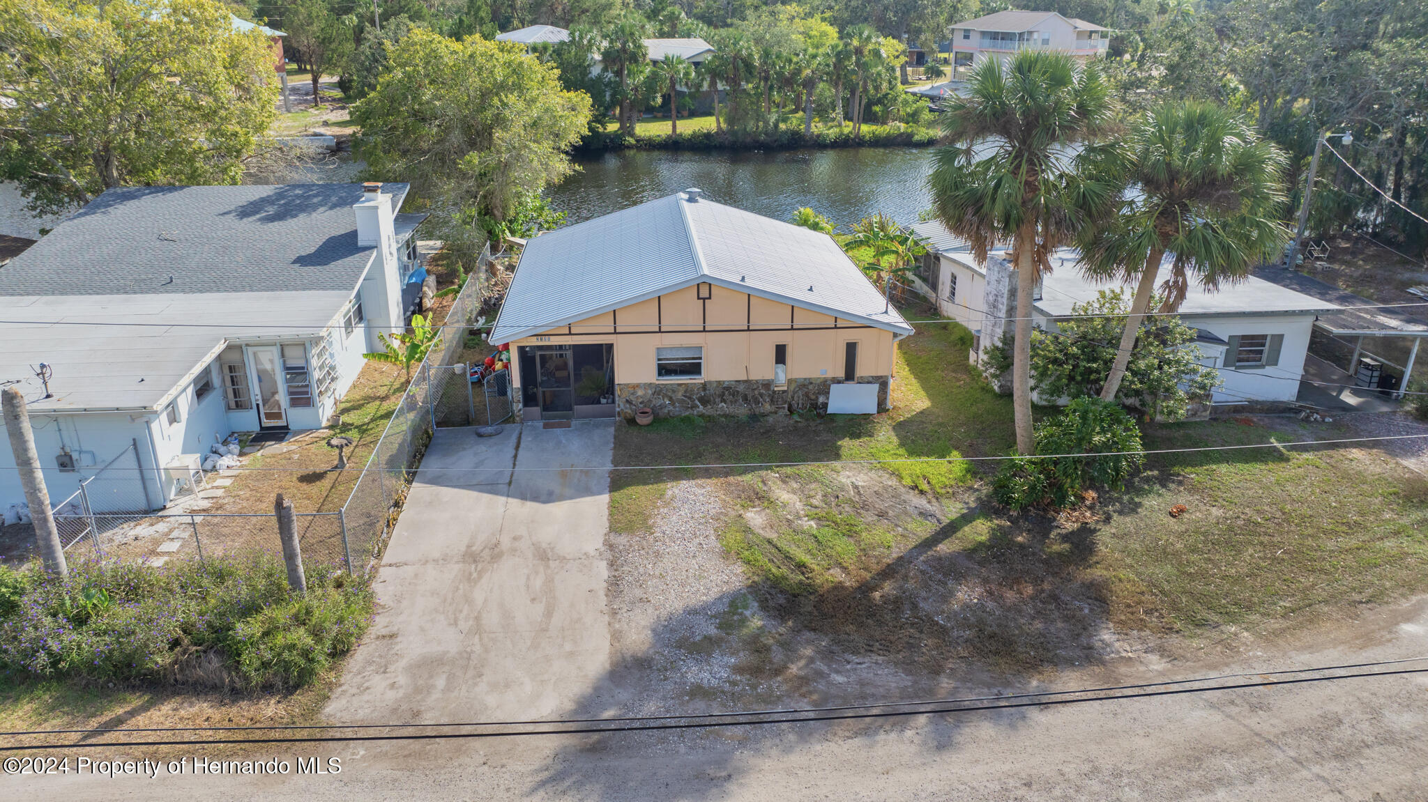 3186 Gulf Drive Aripeka, FL 34607 - Photo 7 of 19 an aerial view of a house with a yard