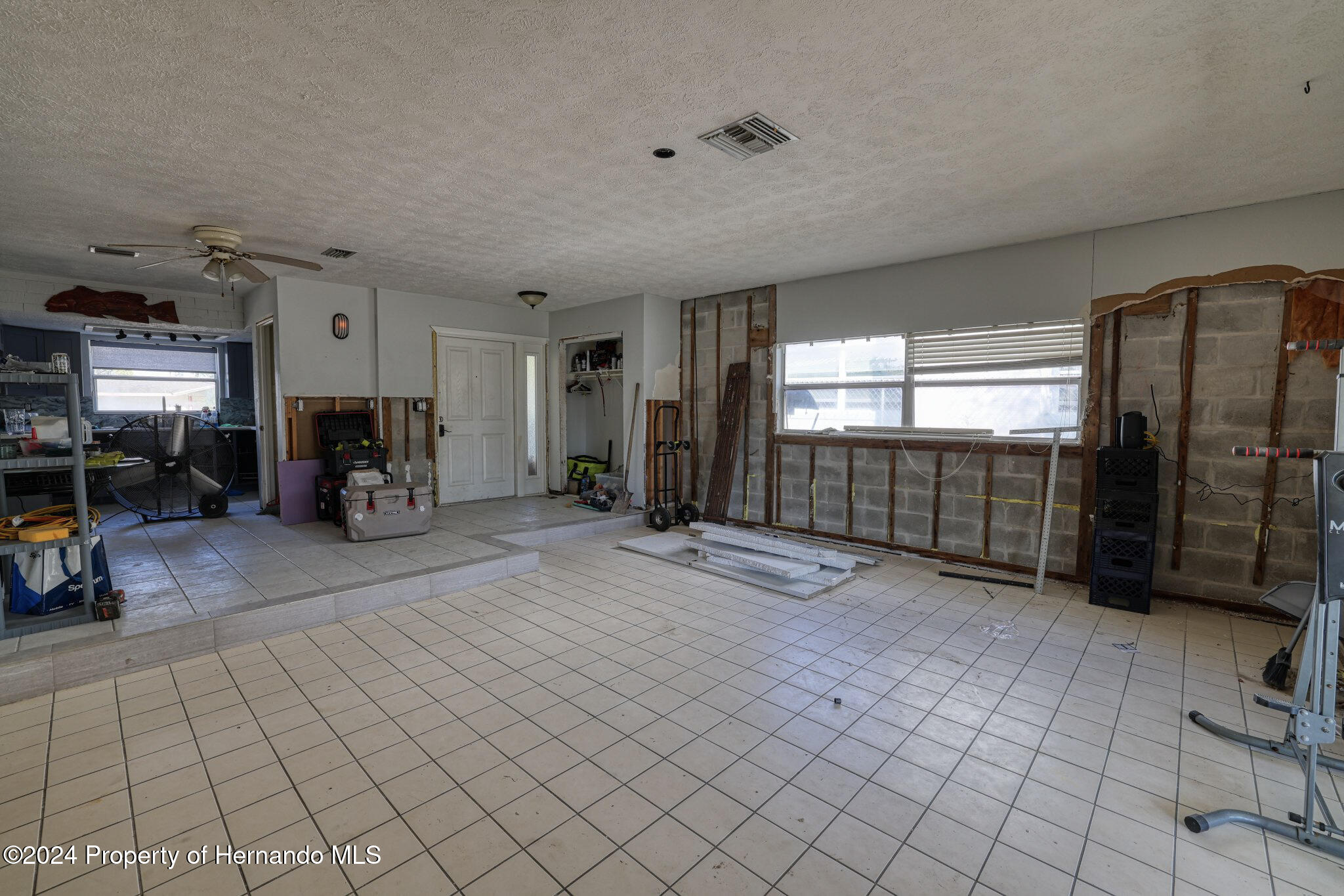 3186 Gulf Drive Aripeka, FL 34607 - Photo 10 of 19 a view of an empty room with furniture and a fireplace