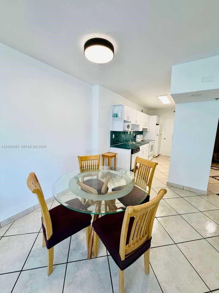100 Lincoln Road, Unit 731 Miami Beach, FL 33139 - Photo 6 of 12 a view of a dining room with furniture