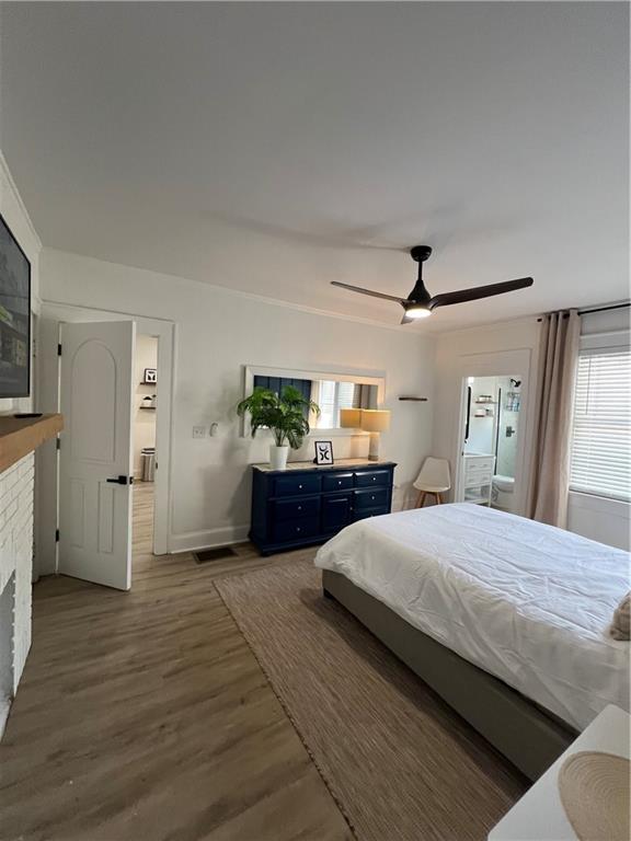 1474 Beecher Street Southwest Atlanta, GA 30310 - Photo 11 of 20 a bedroom with a large bed and a chandelier