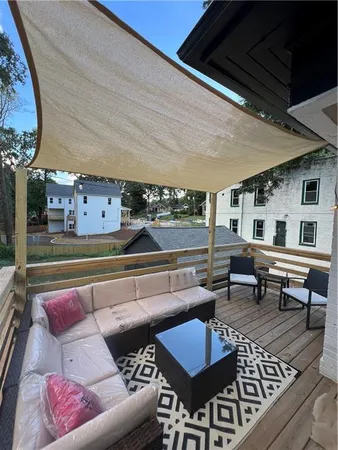 a living room with furniture and a rug
