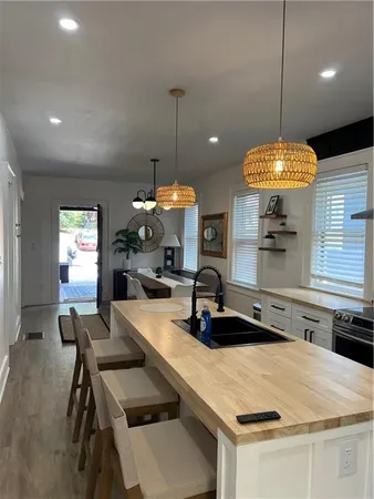 a kitchen with a table and chairs in it
