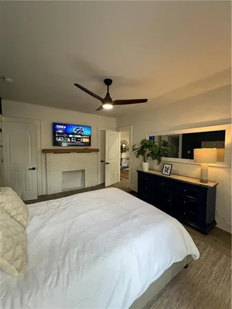 a large bedroom with a bed and a large mirror