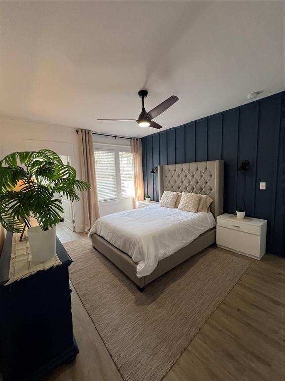 1474 Beecher Street Southwest Atlanta, GA 30310 - Photo 10 of 20 a bedroom with a large bed and a potted plant