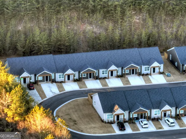 a view of roof deck with furniture and barbeque oven
