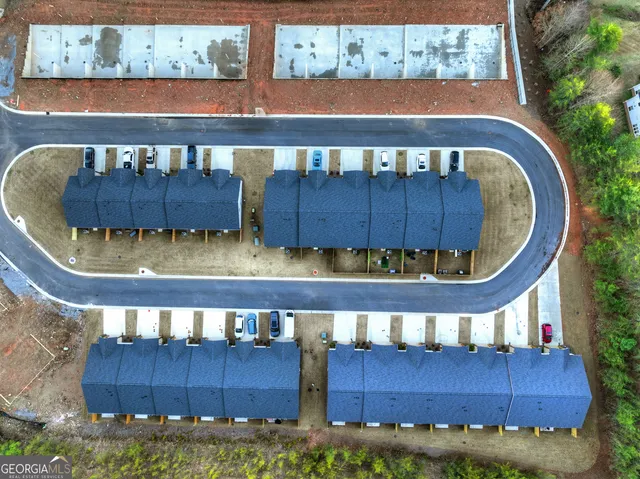 an aerial view of a house with pool