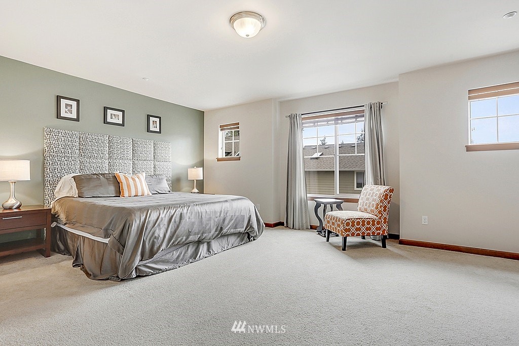 4733 Northeast 13th Place Renton, WA 98059 - Photo 12 of 20 a bedroom with a bed and a couch