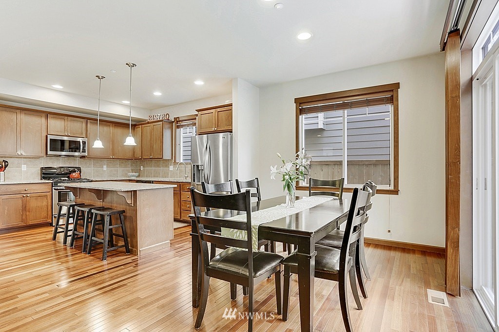 4733 Northeast 13th Place Renton, WA 98059 - Photo 5 of 20 a view of a dining room with furniture and wooden floor