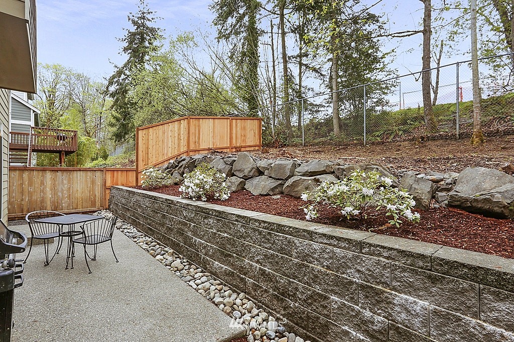 4733 Northeast 13th Place Renton, WA 98059 - Photo 10 of 20 a view of a chairs and sign on the side of the road