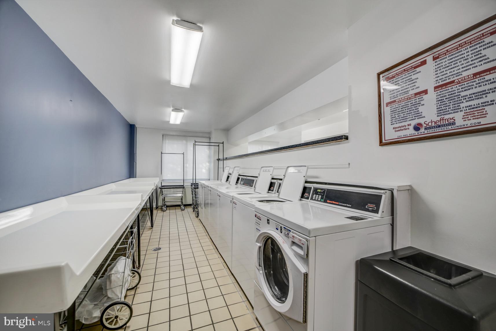 1900 Lyttonsville Road, Unit 1105 Silver Spring, MD 20910 - Photo 14 of 17 a view of a storage & utility room with washer and dryer