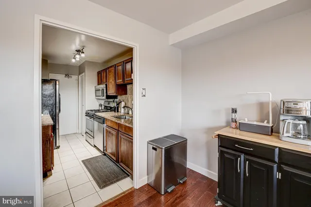 a kitchen with a sink cabinets and stainless steel appliances