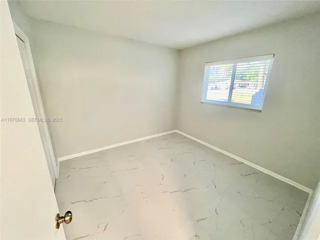 a bathroom with a sink toilet tub and shower