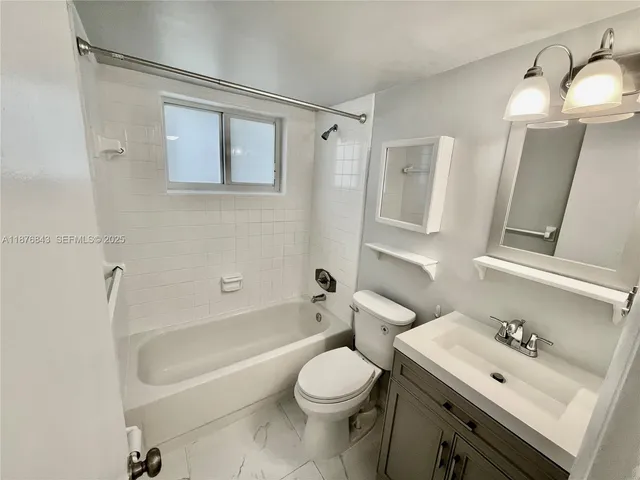 a kitchen with stainless steel appliances a refrigerator sink and microwave