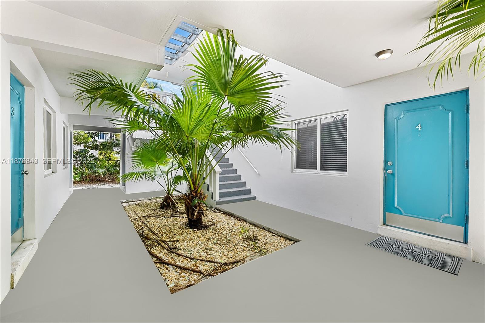 2616 Northeast 14th Avenue, Unit 2 Wilton Manors, FL 33334 - Photo 3 of 16 a vase of flowers sitting on a floor
