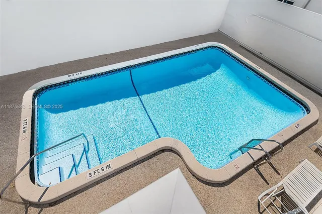 a kitchen with stainless steel appliances a refrigerator stove and microwave