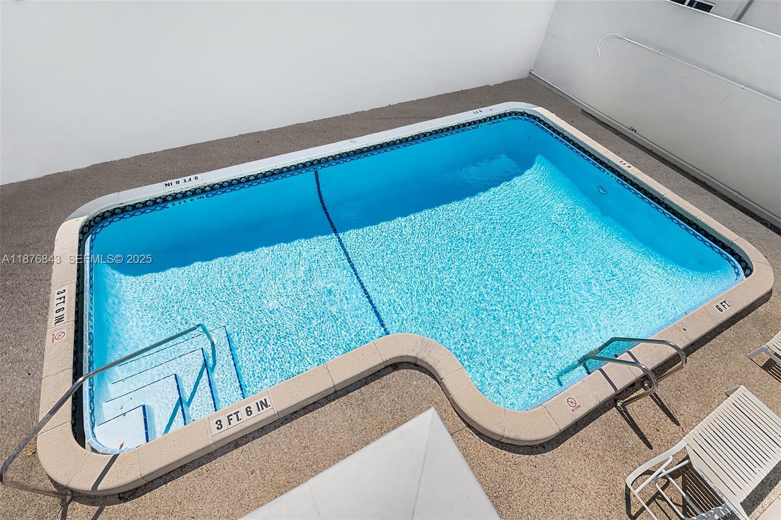 2616 Northeast 14th Avenue, Unit 2 Wilton Manors, FL 33334 - Photo 6 of 16 a wooden bench sitting in deck of a house