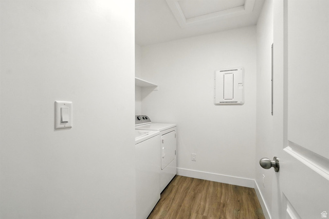 1221 West 1870 South Logan, UT 84321 - Photo 11 of 20 Dedicated laundry space featuring wood-finish flooring, white walls, and a built-in overhead shelf