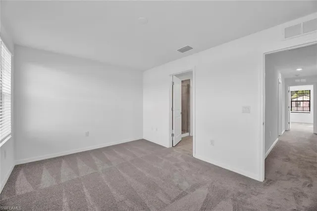 a bathroom with a granite countertop sink mirror and double