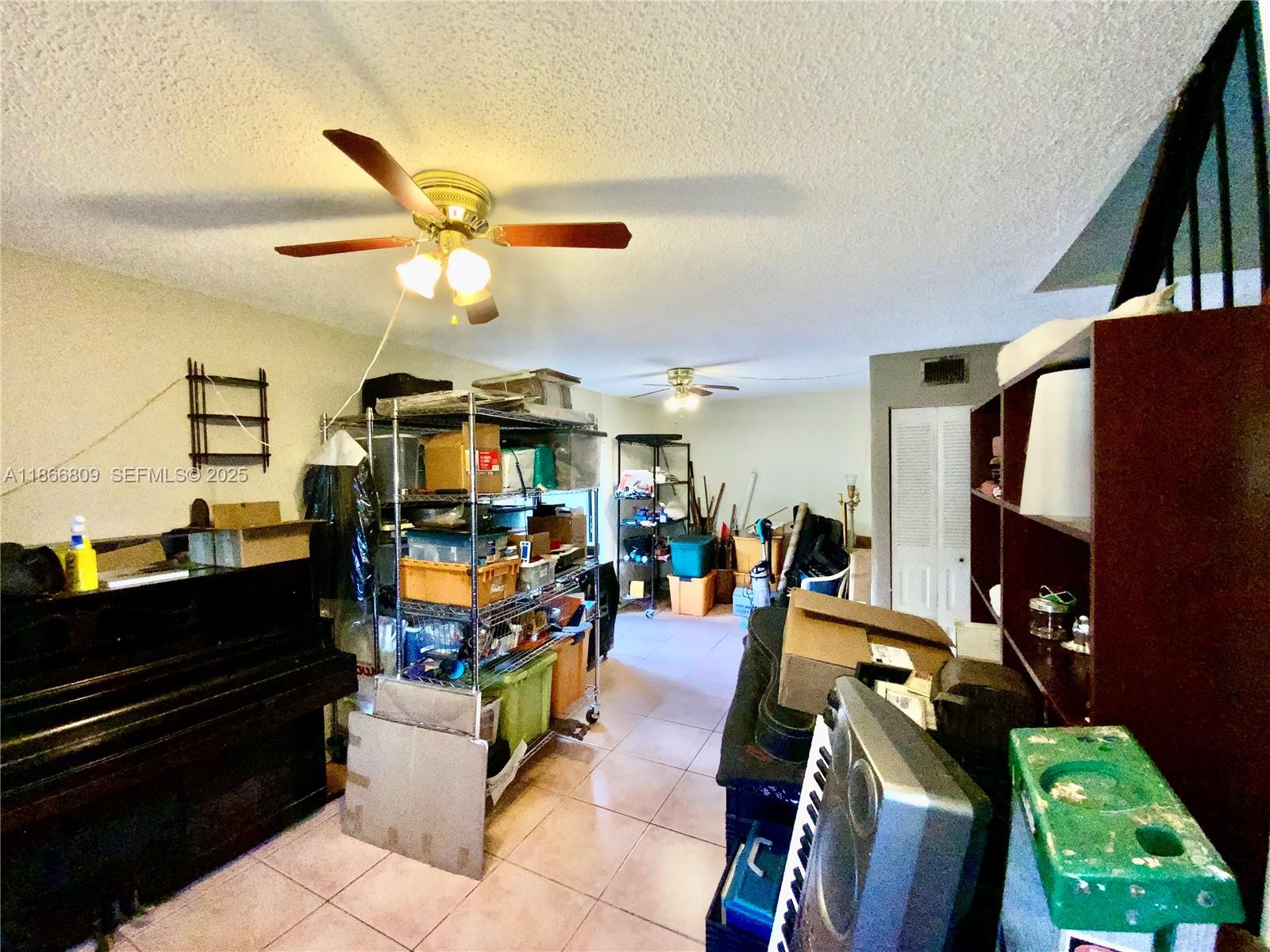 7024 Southwest 114th Place, Unit A52 Miami, FL 33173 - Photo 12 of 41 a living room with lots of furniture and a flat screen tv