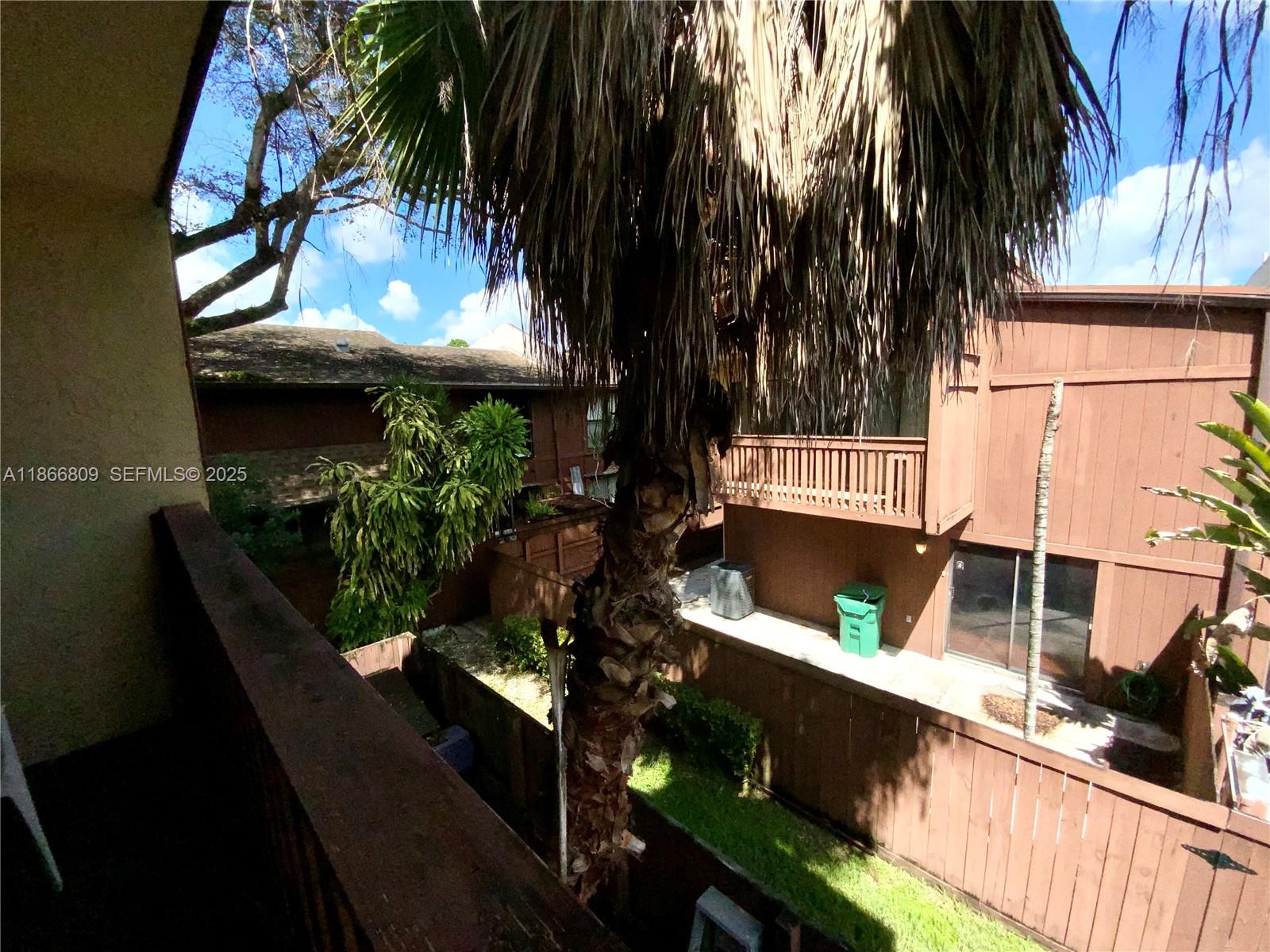7024 Southwest 114th Place, Unit A52 Miami, FL 33173 - Photo 18 of 41 a view of balcony and yard
