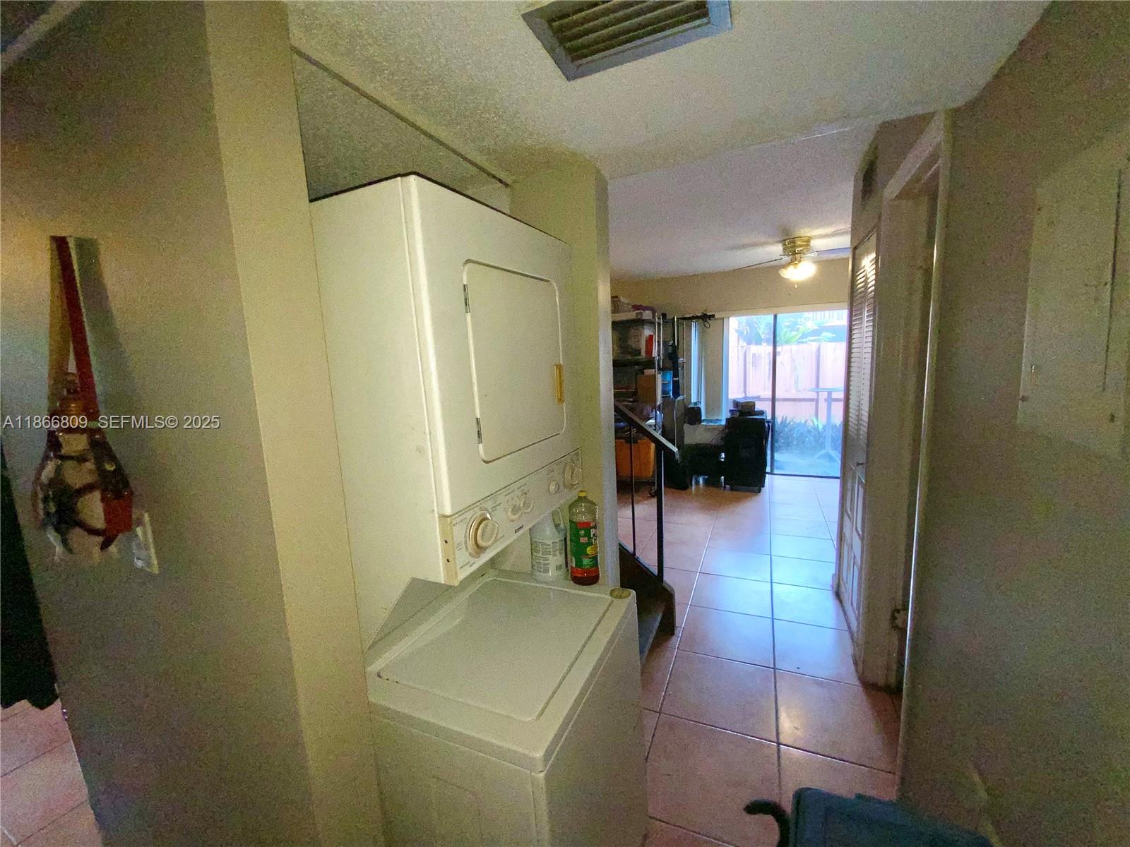 7024 Southwest 114th Place, Unit A52 Miami, FL 33173 - Photo 22 of 41 a hallway with a view of living room