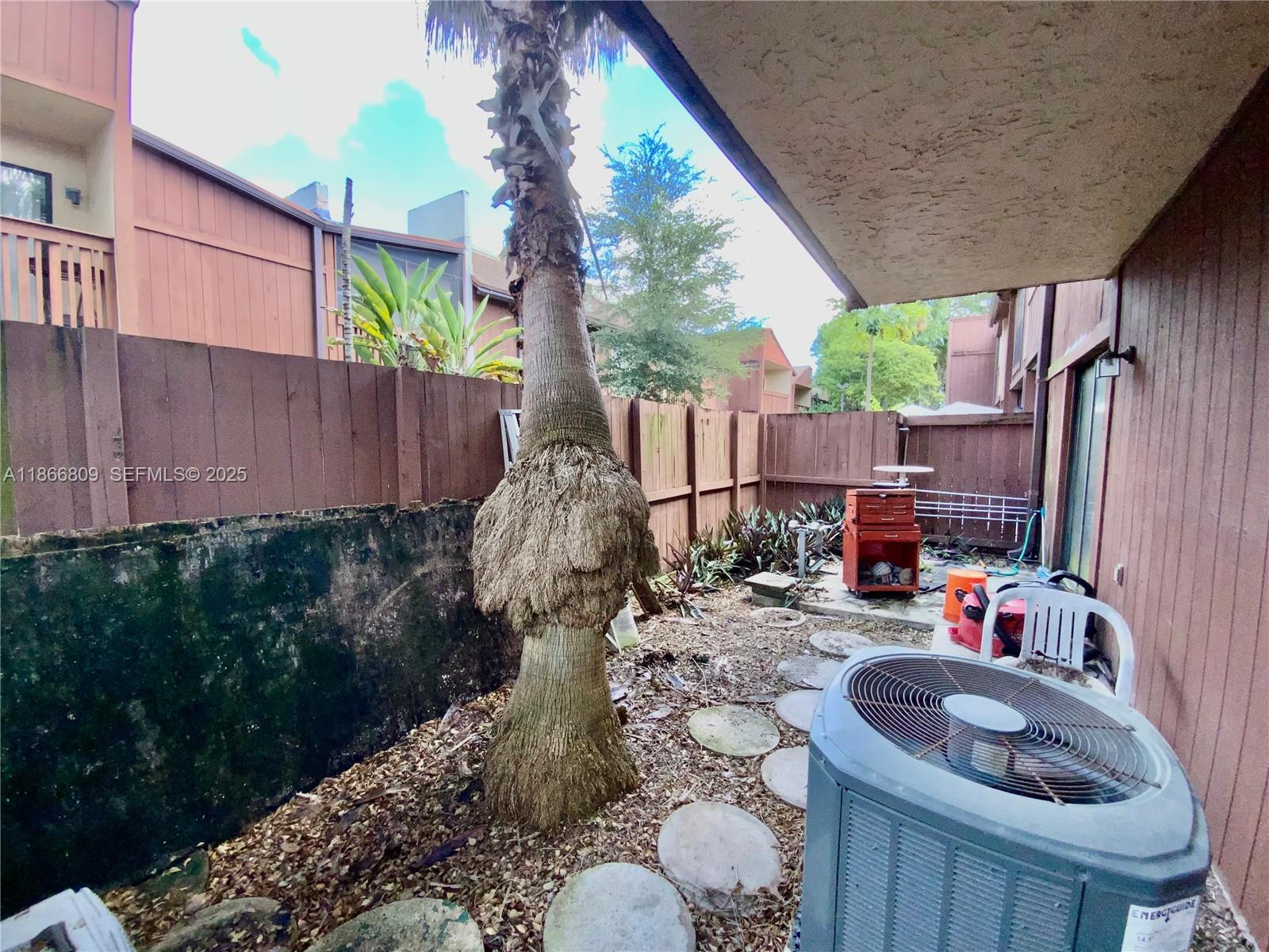 7024 Southwest 114th Place, Unit A52 Miami, FL 33173 - Photo 27 of 41 a view of balcony with furniture and garden