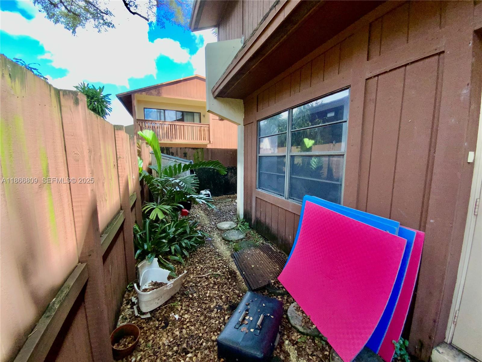 7024 Southwest 114th Place, Unit A52 Miami, FL 33173 - Photo 30 of 41 a view of an outdoor space with a patio