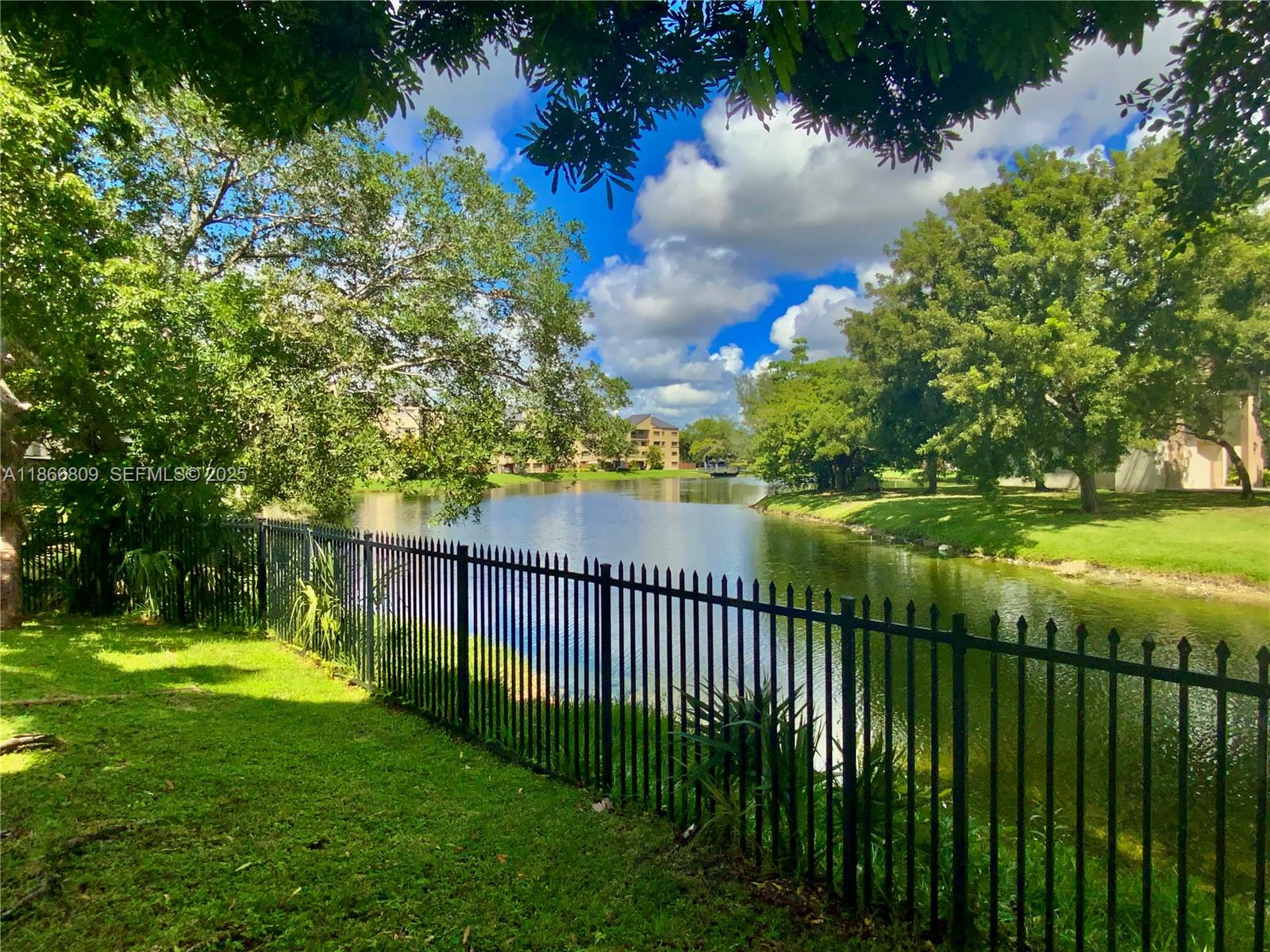 7024 Southwest 114th Place, Unit A52 Miami, FL 33173 - Photo 41 of 41 a view of a garden and lake view