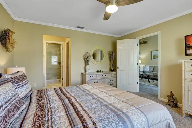 a bedroom with bed and wooden floor