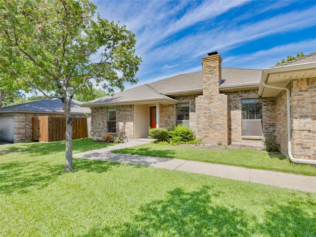 a house view with a garden space