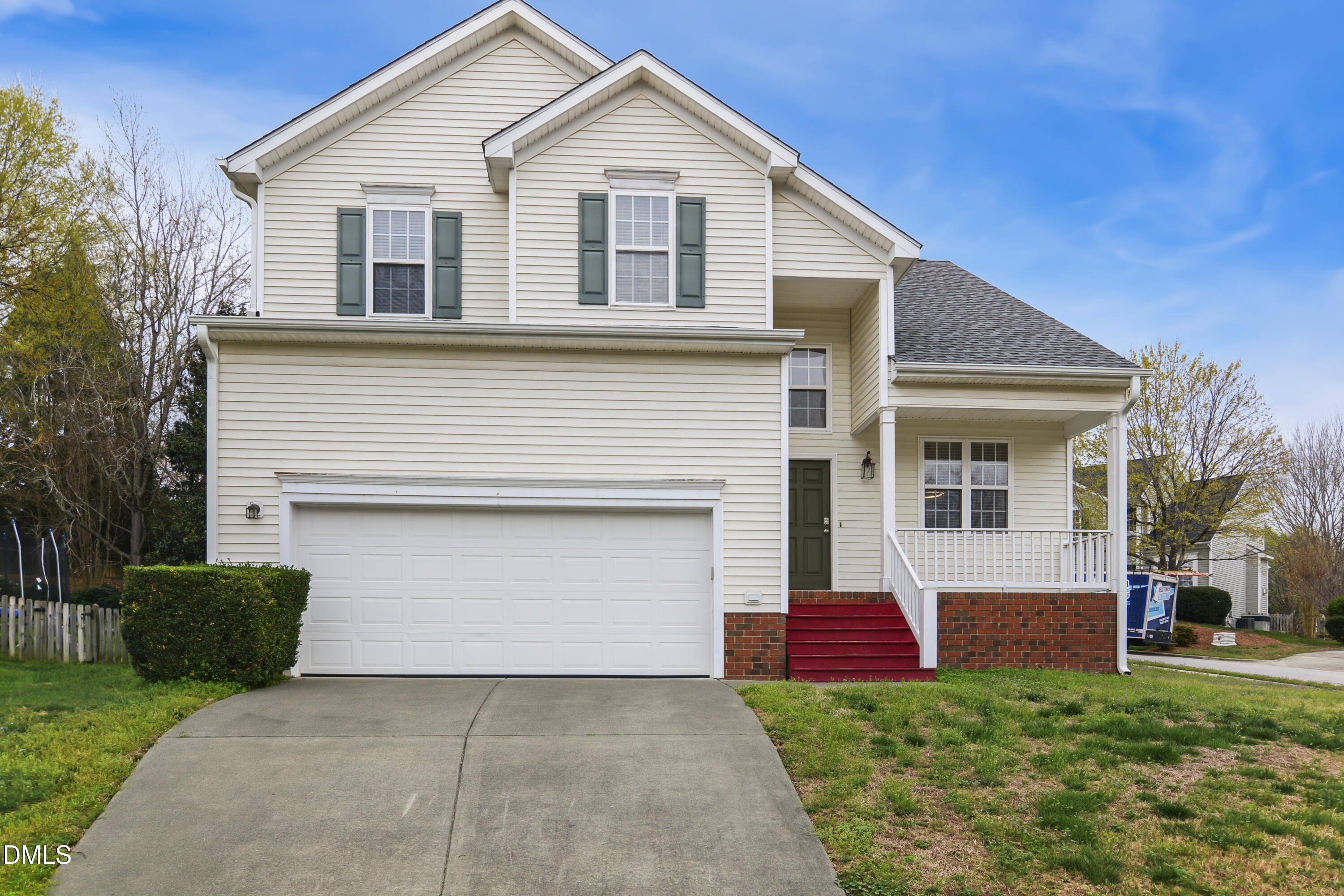 2241 Spruce Shadows Lane Raleigh, NC 27614 - Photo 1 of 29 a front view of a house with a yard and garage