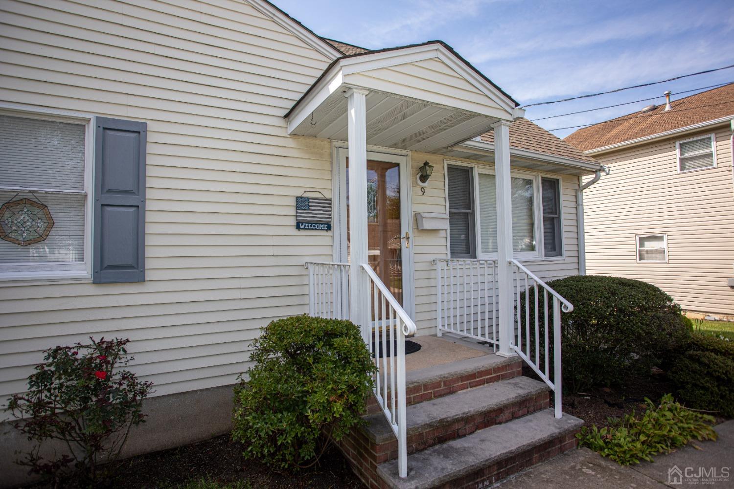 9 Becker Drive Sayreville, NJ 08859 - Photo 11 of 39 a view of a house with a small porch and furniture