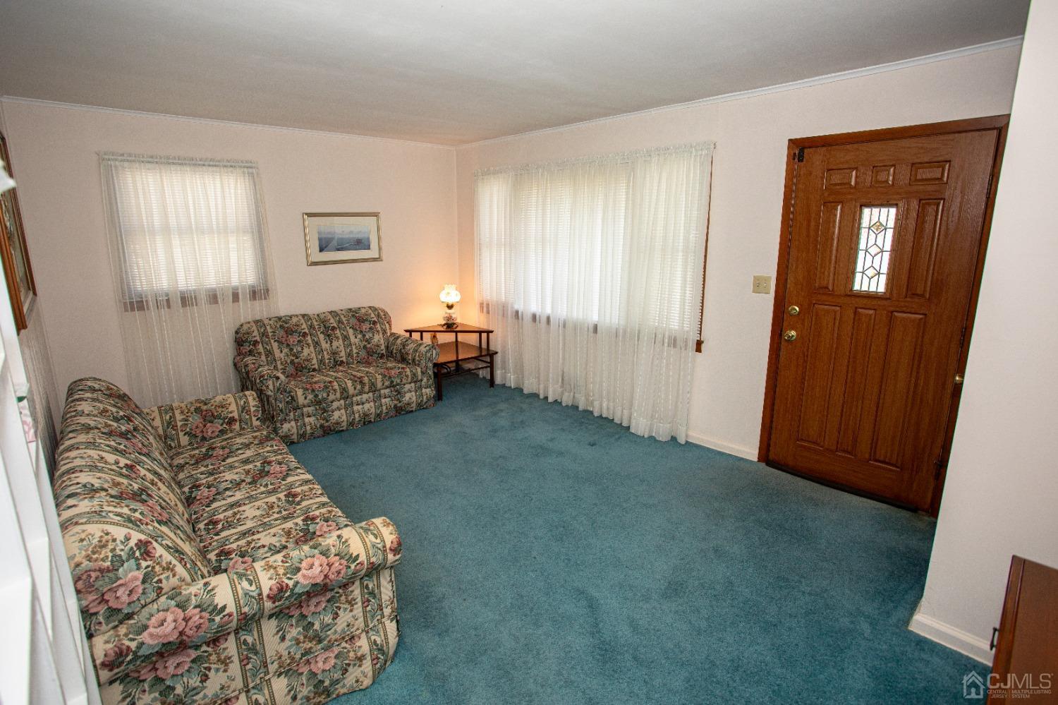 9 Becker Drive Sayreville, NJ 08859 - Photo 12 of 39 a living room with furniture and a window
