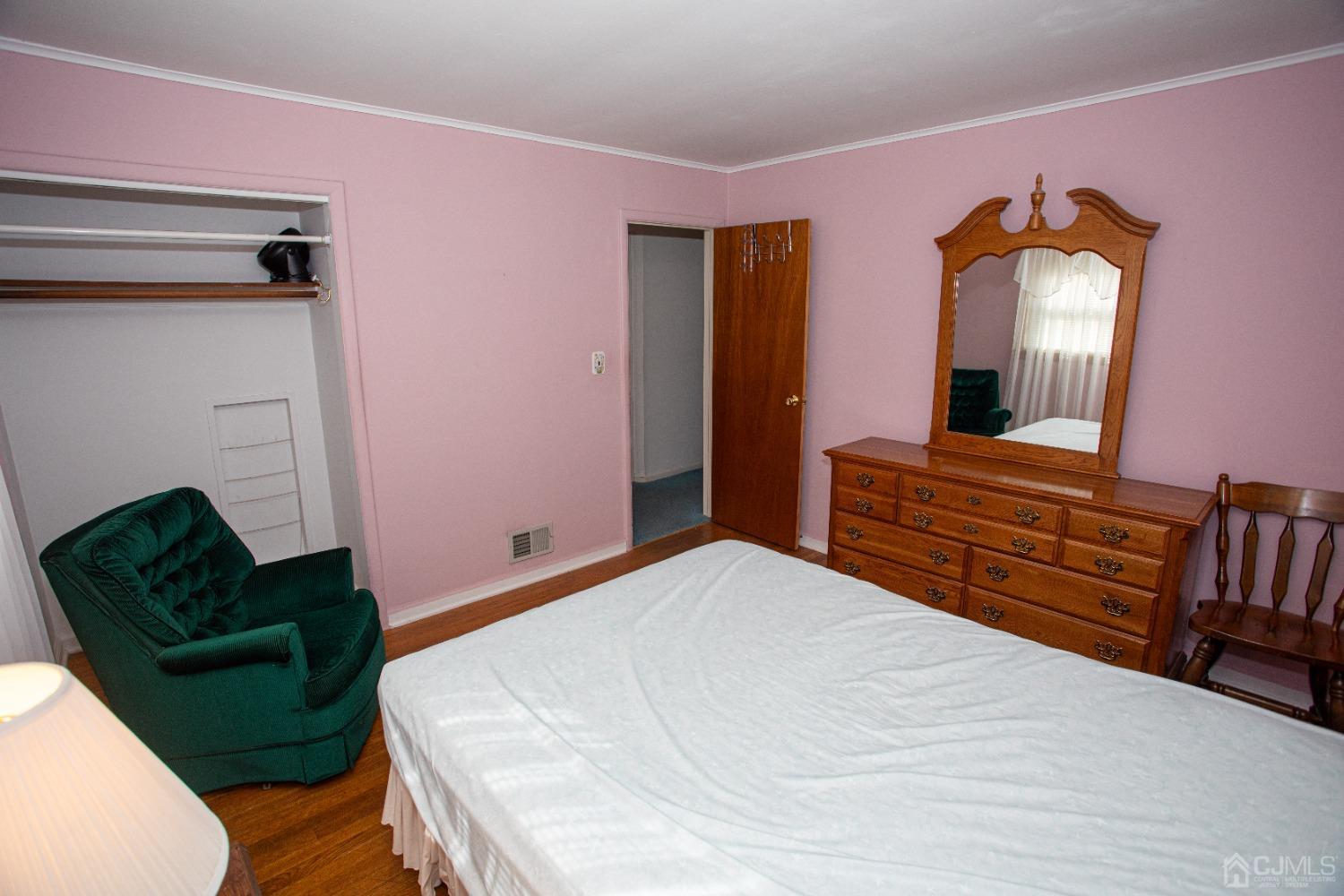 9 Becker Drive Sayreville, NJ 08859 - Photo 17 of 39 a bedroom with a bed and a mirror