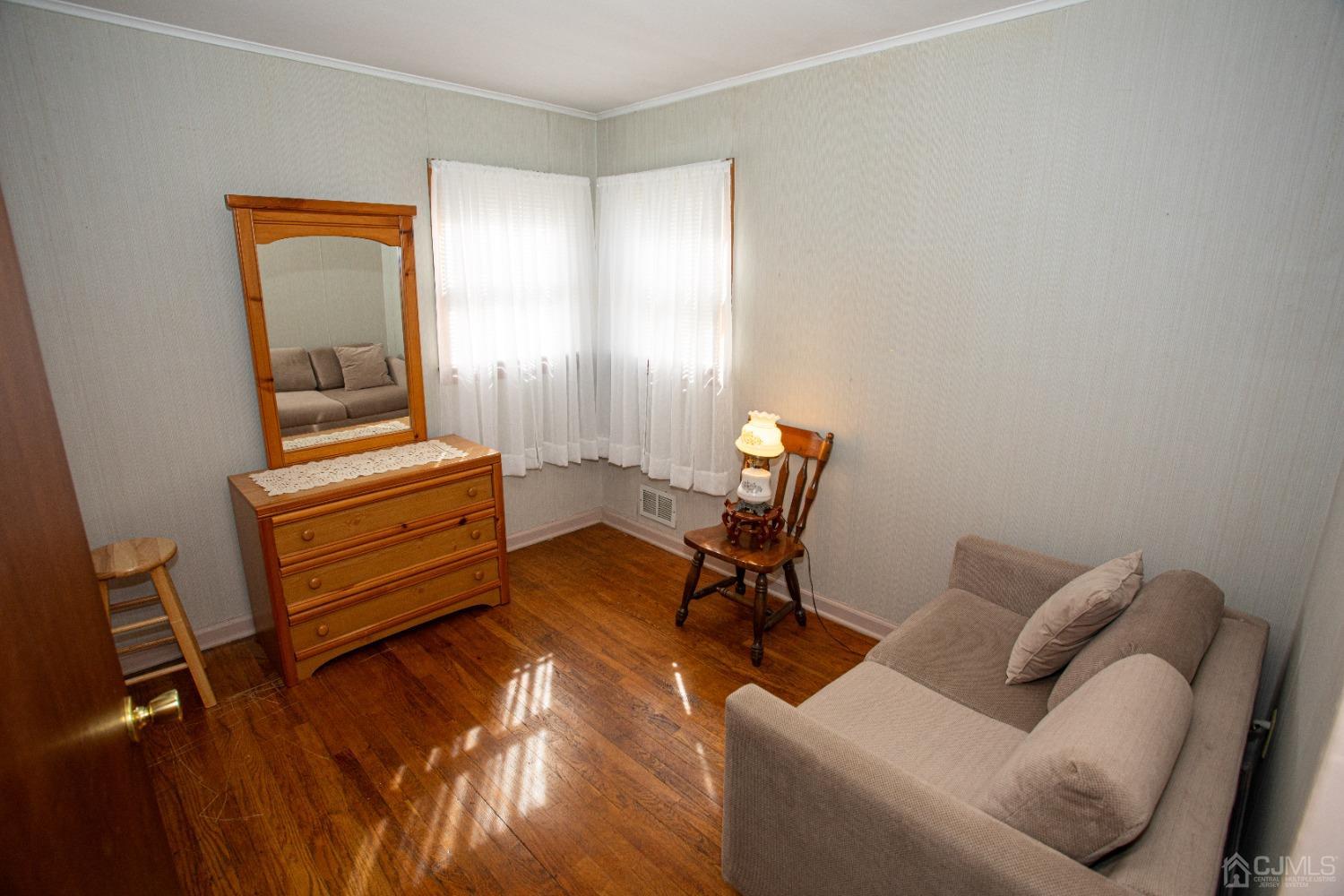 9 Becker Drive Sayreville, NJ 08859 - Photo 18 of 39 a living room with furniture and a window