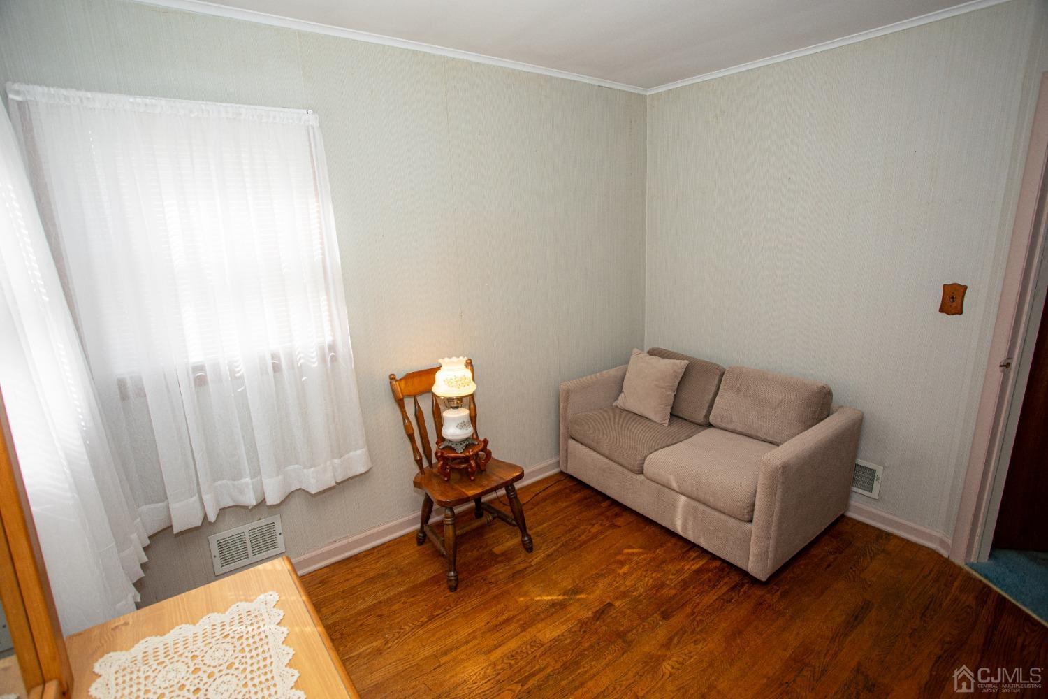 9 Becker Drive Sayreville, NJ 08859 - Photo 19 of 39 a living room with furniture and a window
