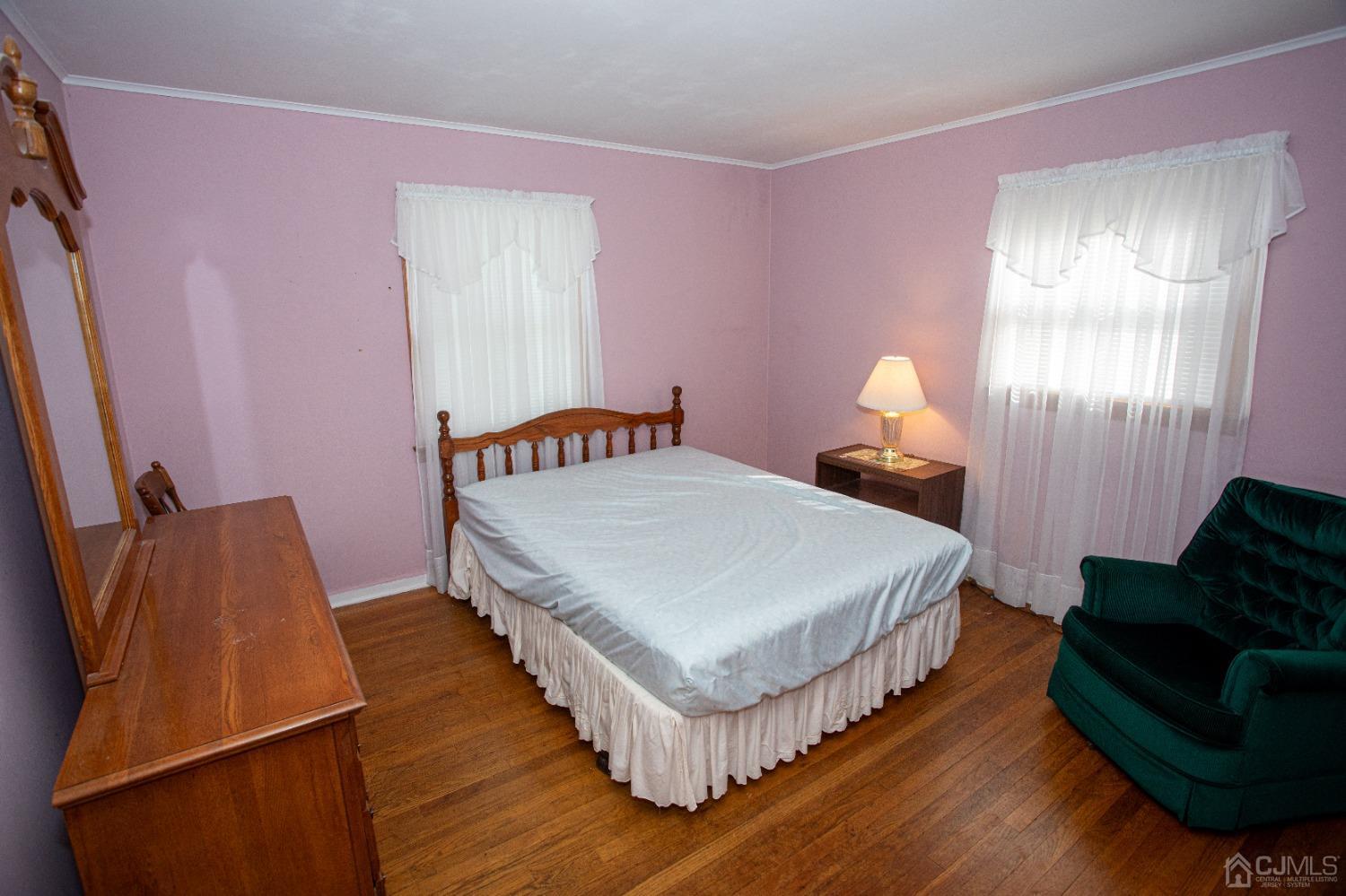 9 Becker Drive Sayreville, NJ 08859 - Photo 4 of 39 a bedroom with a bed and window