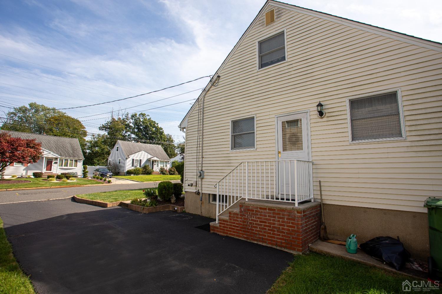 9 Becker Drive Sayreville, NJ 08859 - Photo 7 of 39 a front view of a house with a yard