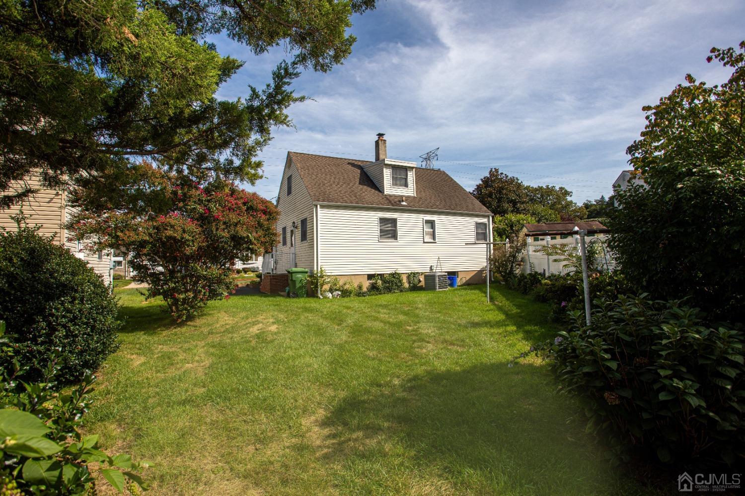 9 Becker Drive Sayreville, NJ 08859 - Photo 8 of 39 a front view of a house with a yard