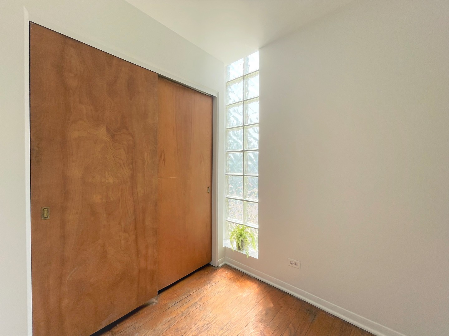 341 Custer Avenue, Unit 2 Evanston, IL 60202 - Photo 4 of 19 a view of an empty room with a window