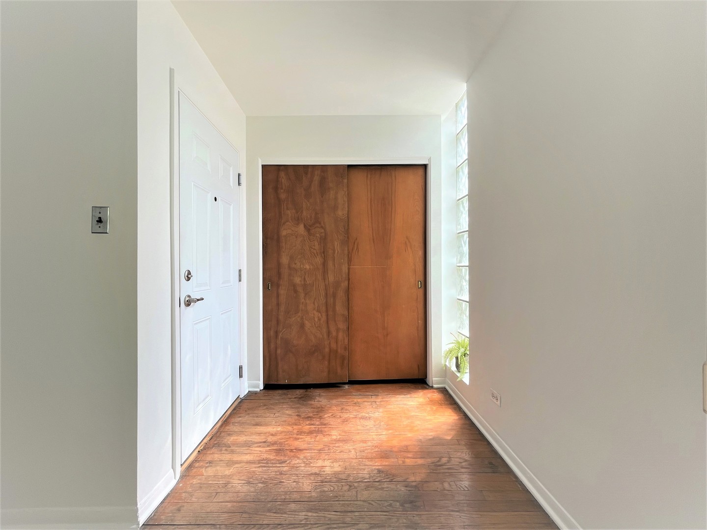 341 Custer Avenue, Unit 2 Evanston, IL 60202 - Photo 5 of 19 a view of an empty room with wooden door