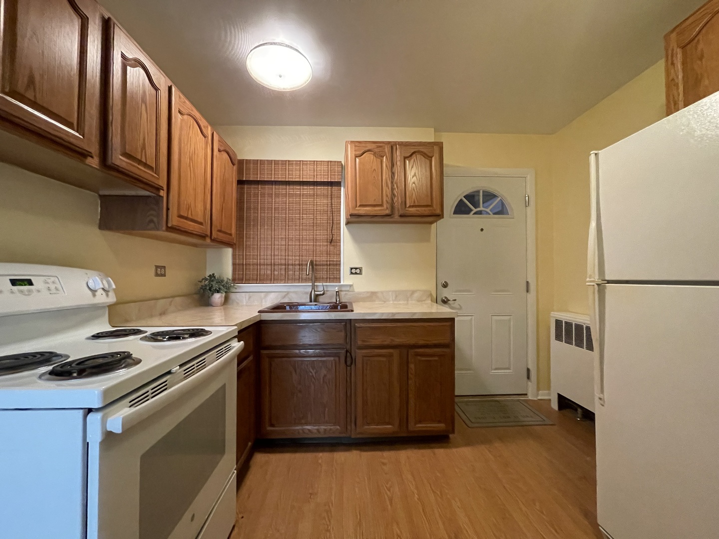 341 Custer Avenue, Unit 2 Evanston, IL 60202 - Photo 9 of 19 a kitchen with stainless steel appliances granite countertop a stove a sink and a refrigerator