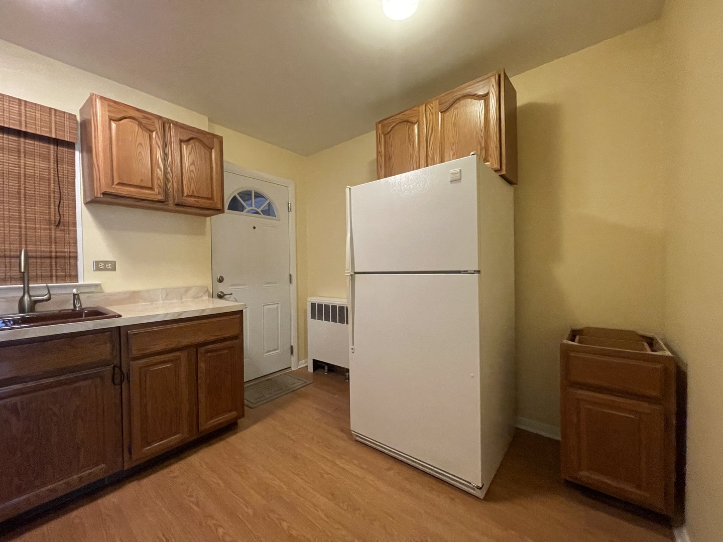 341 Custer Avenue, Unit 2 Evanston, IL 60202 - Photo 10 of 19 a kitchen with a refrigerator and a sink