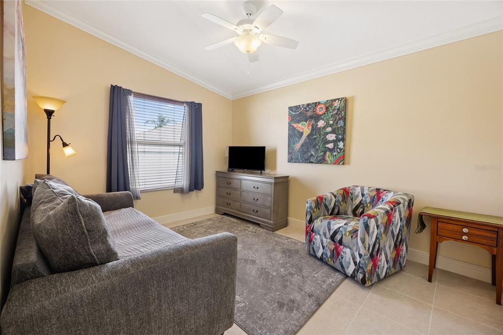 2372 Travis Place The Villages, FL 32162 - Photo 12 of 33 a living room with furniture and a flat screen tv