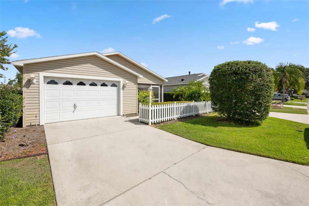 2372 Travis Place The Villages, FL 32162 - Photo 20 of 33 a view of a house with a yard